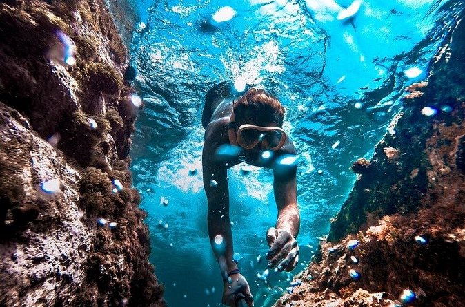 All Day Snorkel Package with Wetsuit Rental - Using the VR videos to find coves and caves