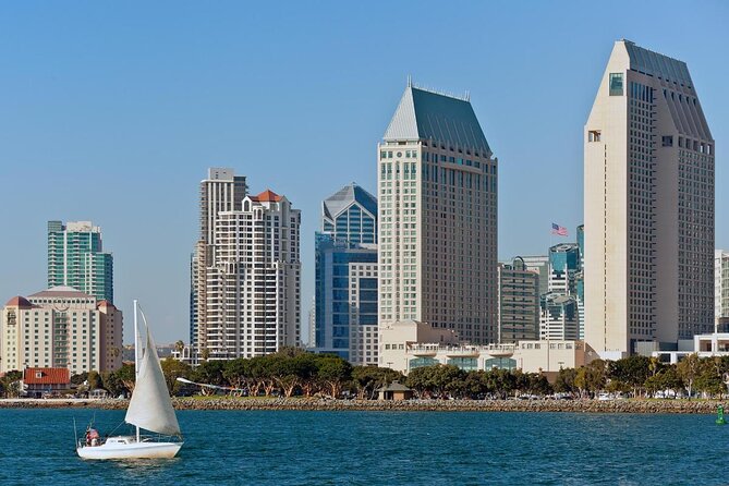 The downtown San Diego skyline from the bay, with a sailboat crossing